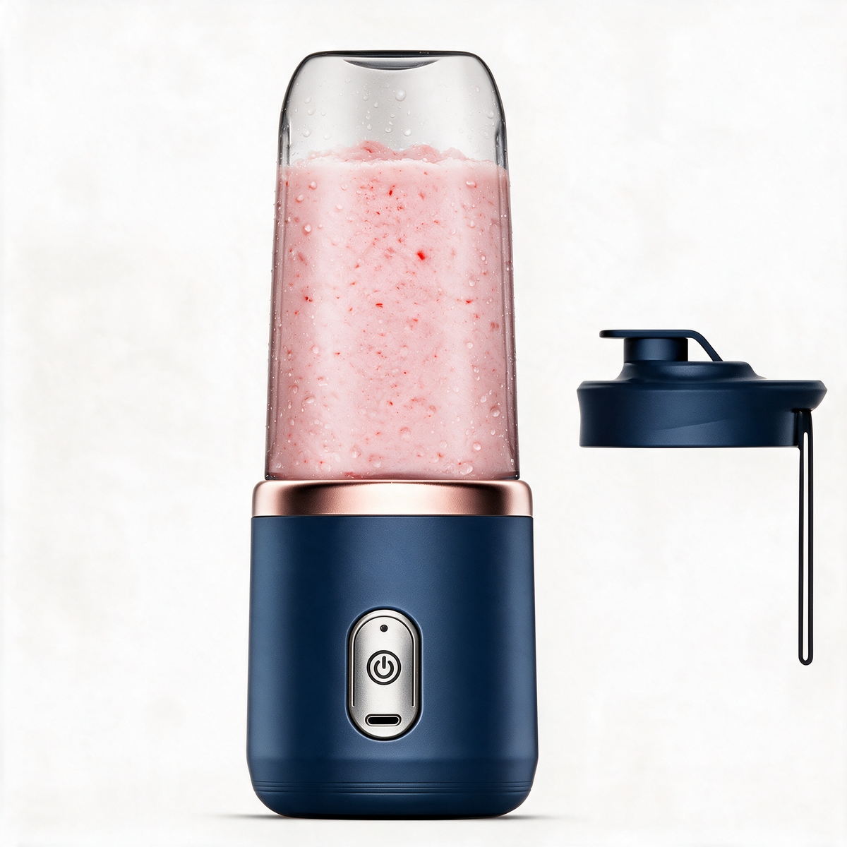 Navy blue portable blender with spare lid with carry strap