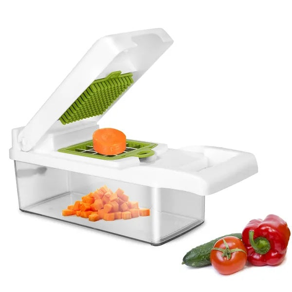 Vegetable chopper with diced carrots in the container next to fresh vegetables