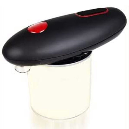 Electric can opener sitting on top of a can while it opens the lid